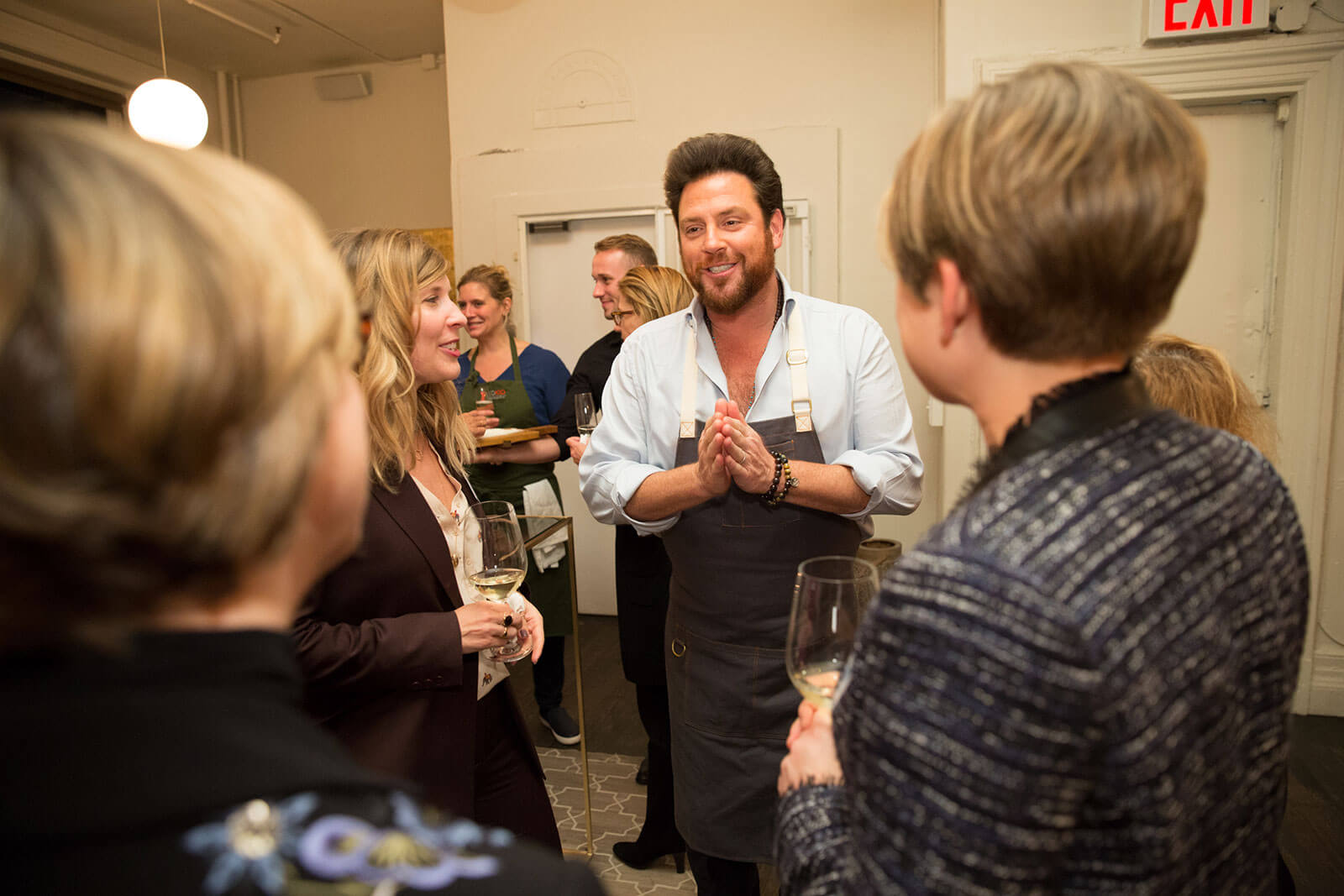 Scott Conant welcomes executives for a signature meal & demo.