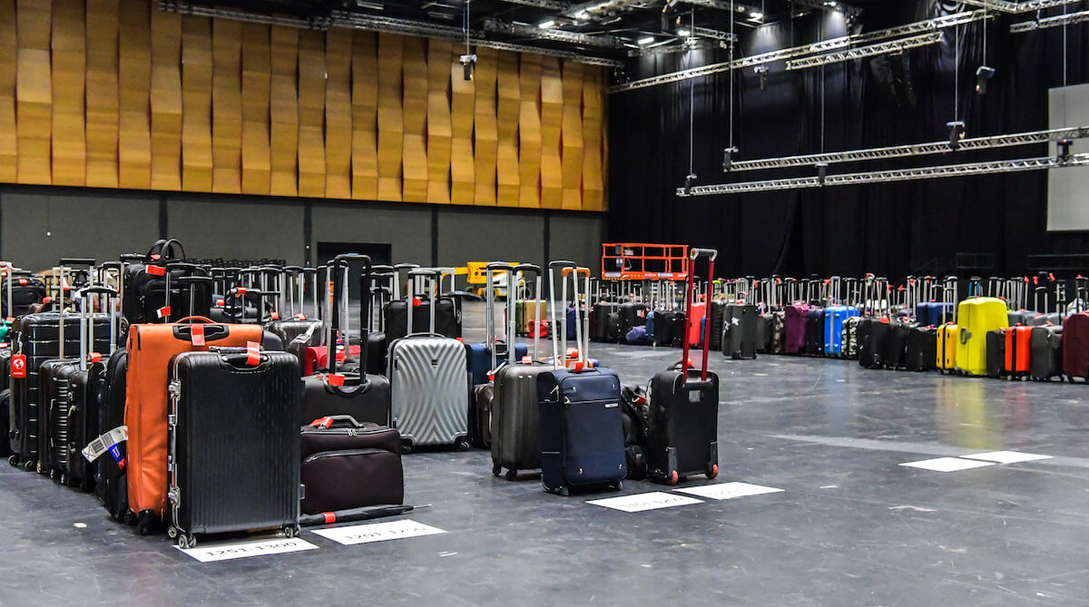 Luggage awaits over 1,500 attendees on the last day of the conference.